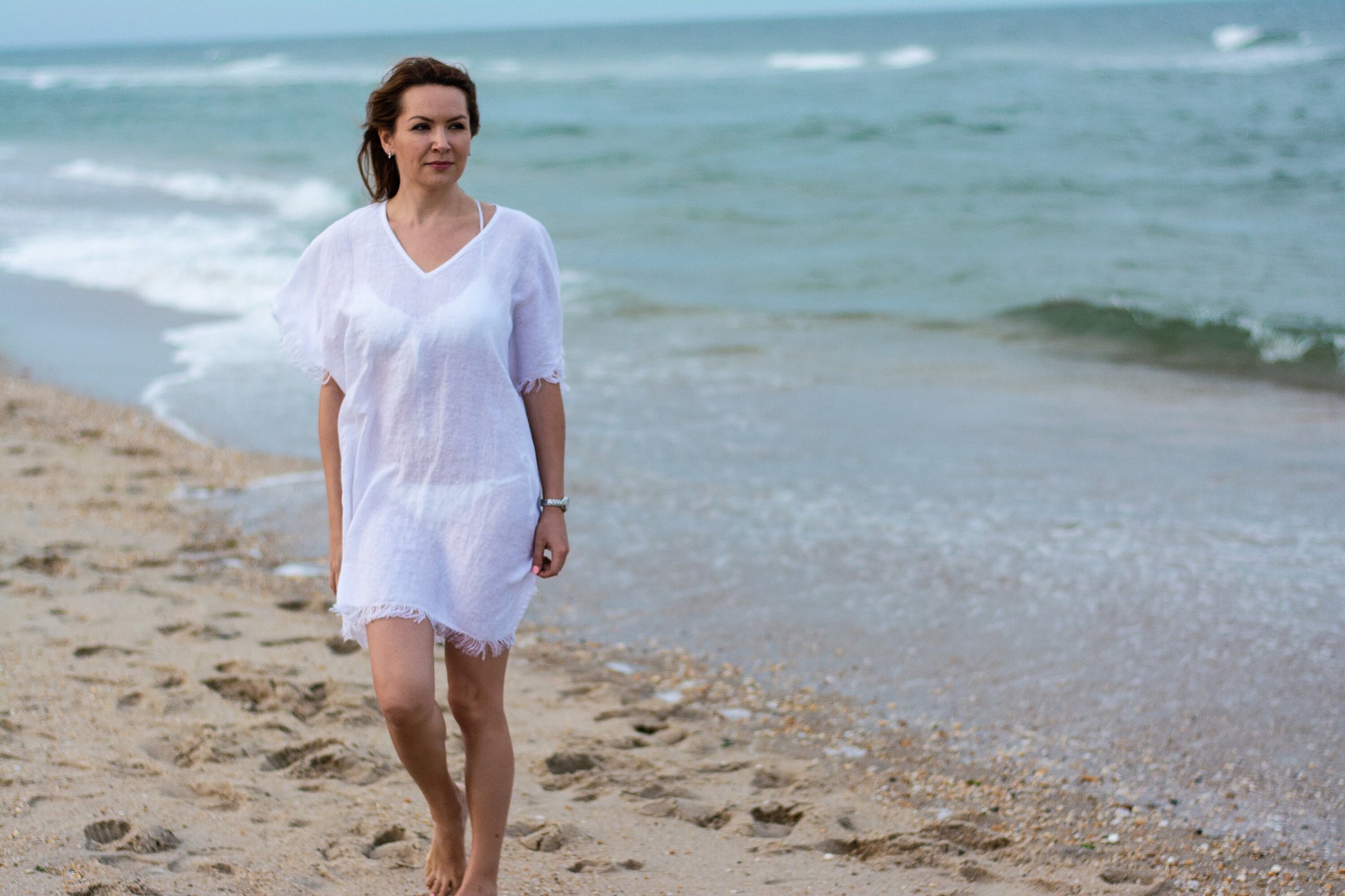 The natural charm of a white linen beach shirt with lovely wrinkles.