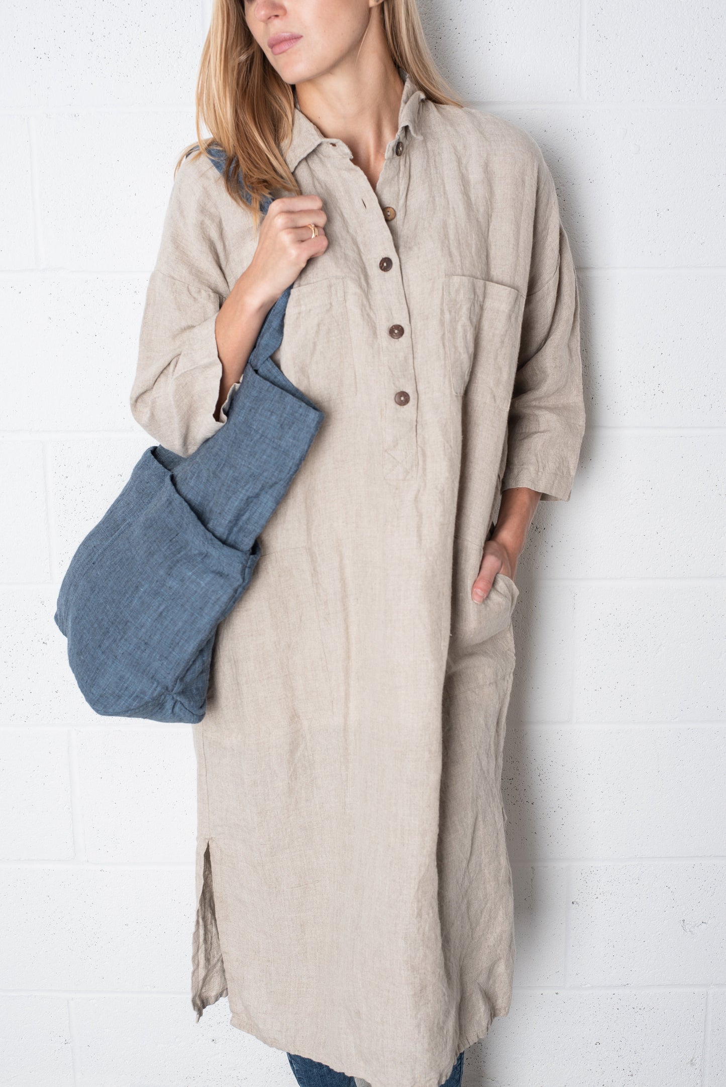 Close-up: Authentic texture and natural wrinkles of a medium-weight linen dress.