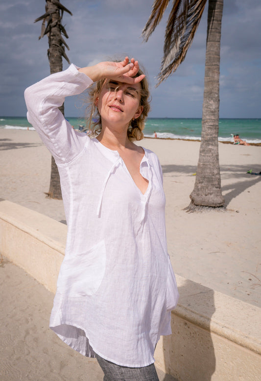 Model radiating summer vibes in a linen beach tunic shirt