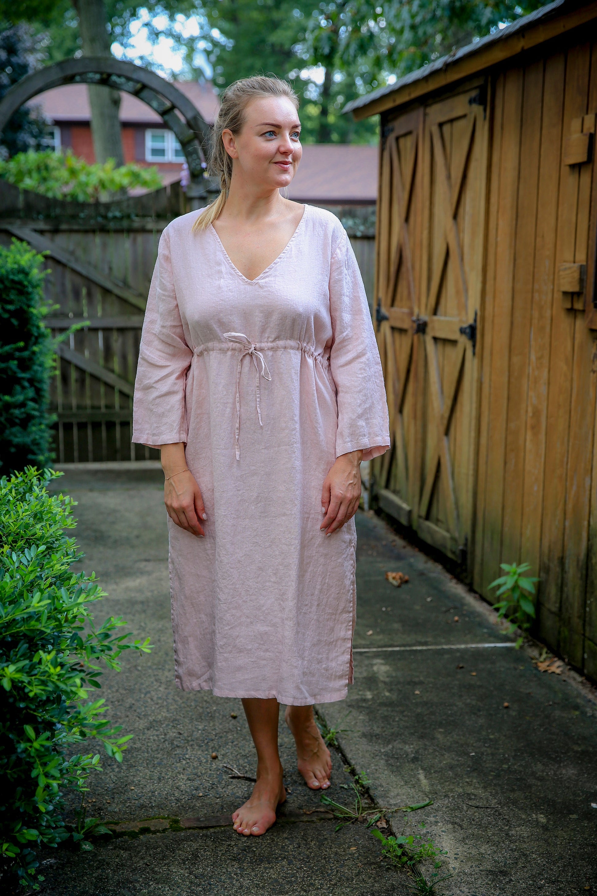 Boho-inspired white linen dress with a hint of dusty rose.