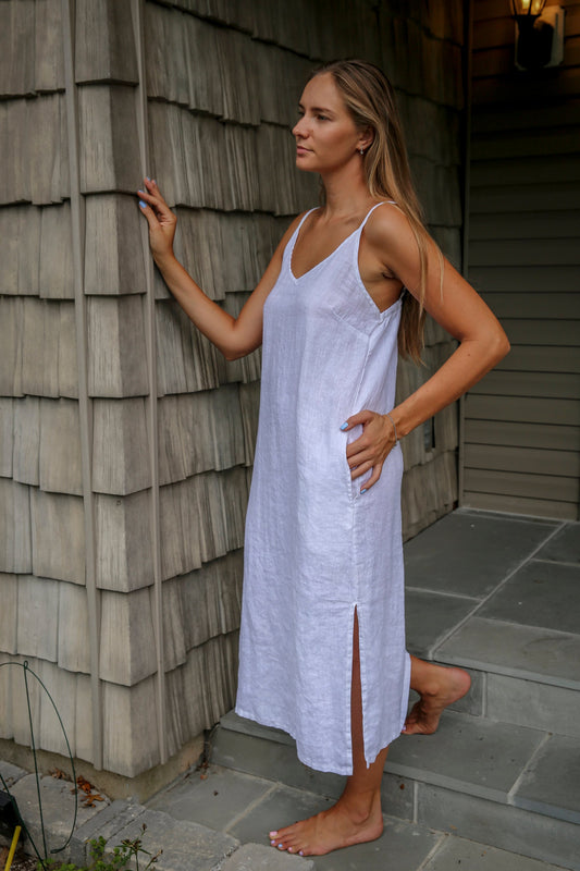 Woman showcasing the elegance of the Linen Maxi Slip Dress at a summer event.