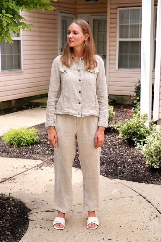 Woman showcasing elegance in a tailored linen crop jacket.