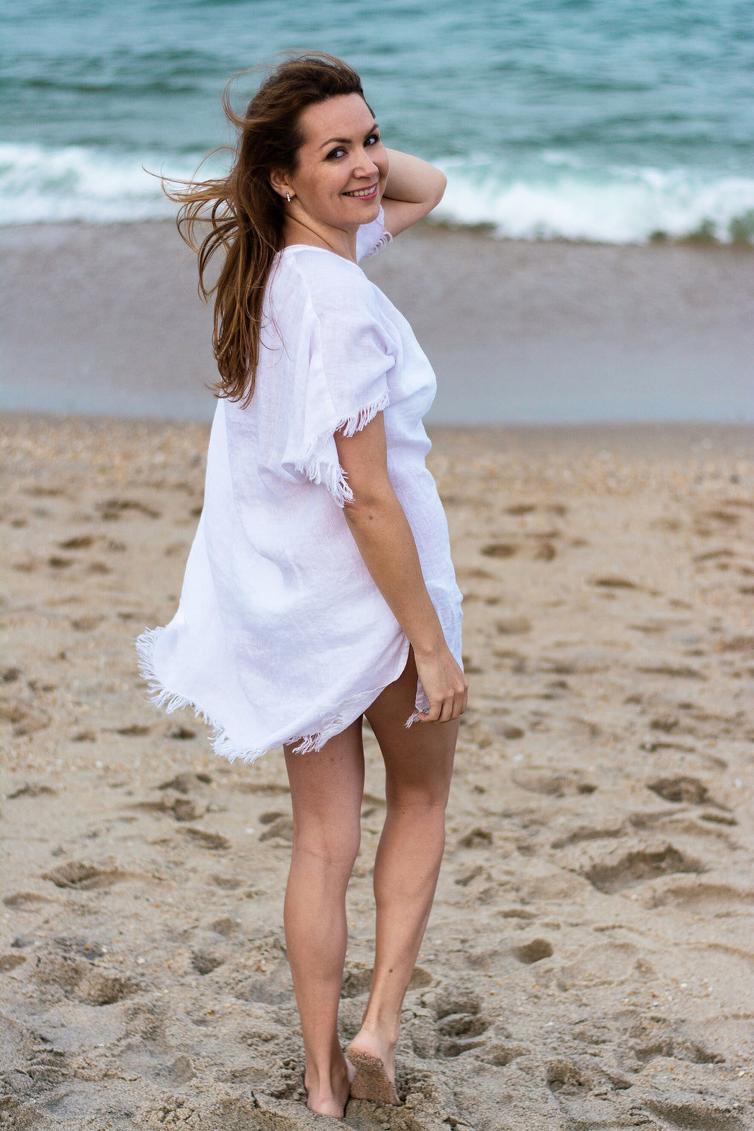 Close-up: The natural texture and wrinkles of a lightweight linen summer dress.