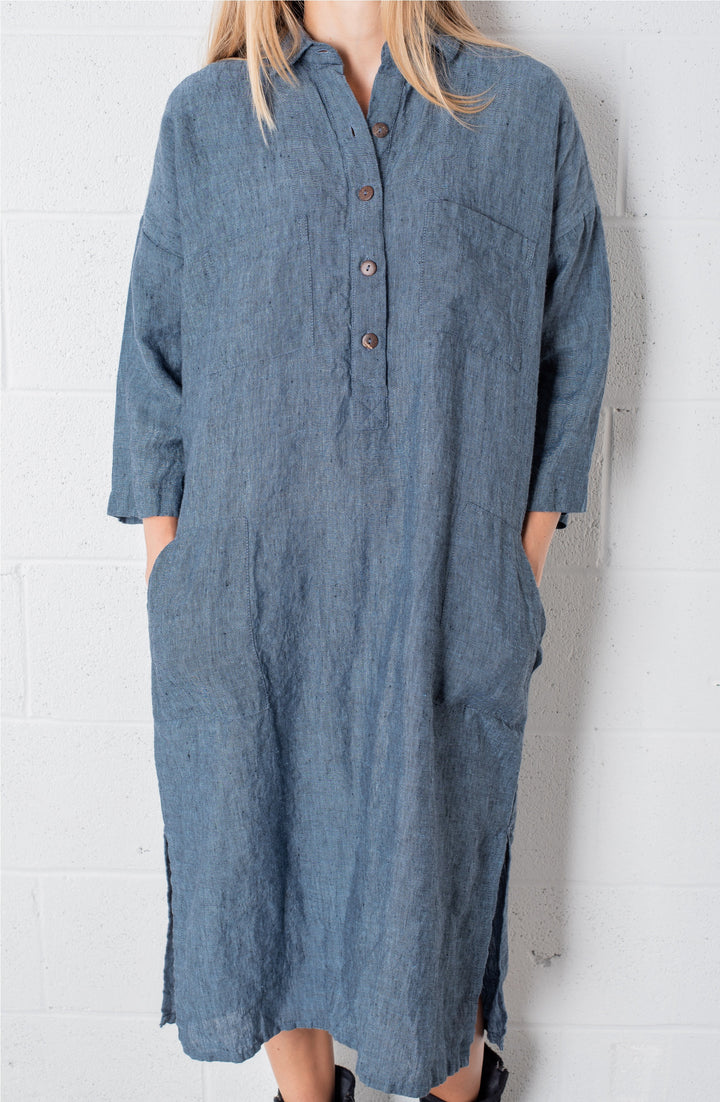 Plus-size elegance: Woman in an oversized linen dress with graceful wrinkles.