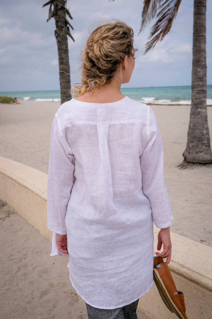 Sun, sea, and style: Woman in a lightweight linen beach tunic