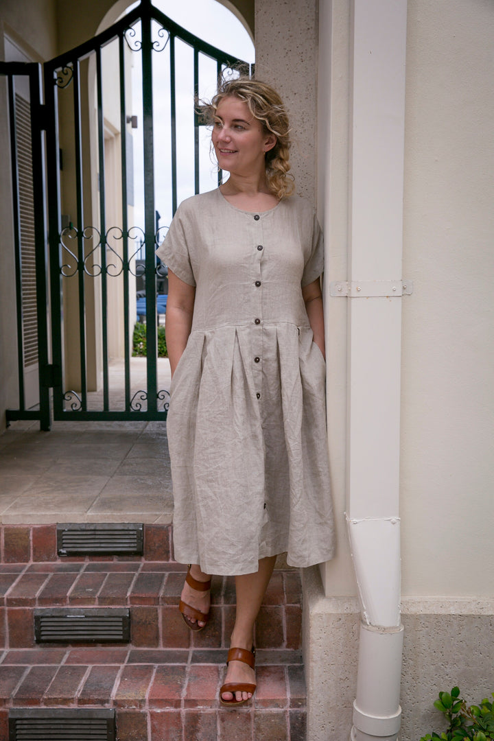 Elegant woman making a statement in the soft and comfortable Linen Adri Dress.