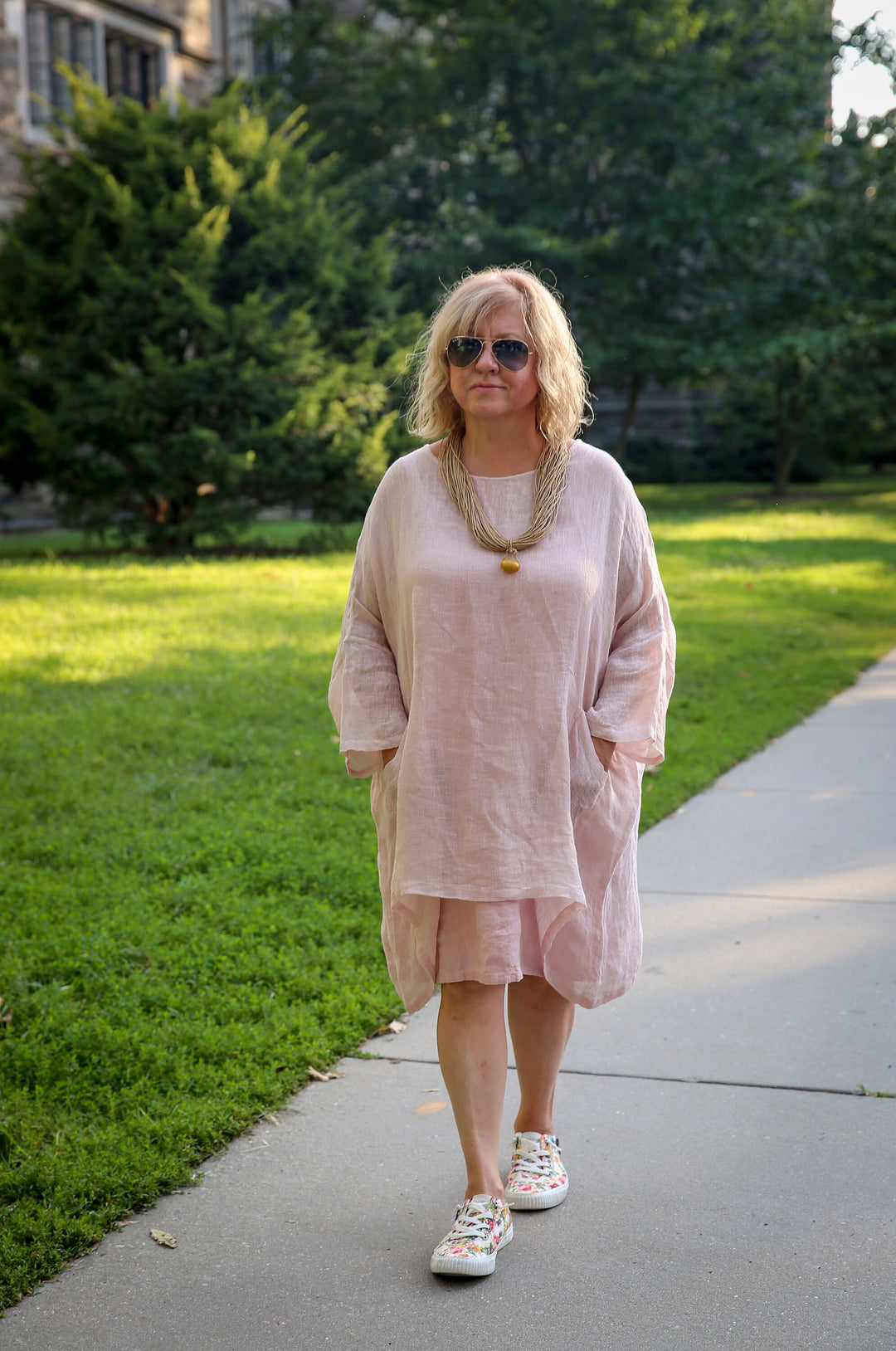 Elegant woman is wearing long sleeve sheer oversized  loose tunic 