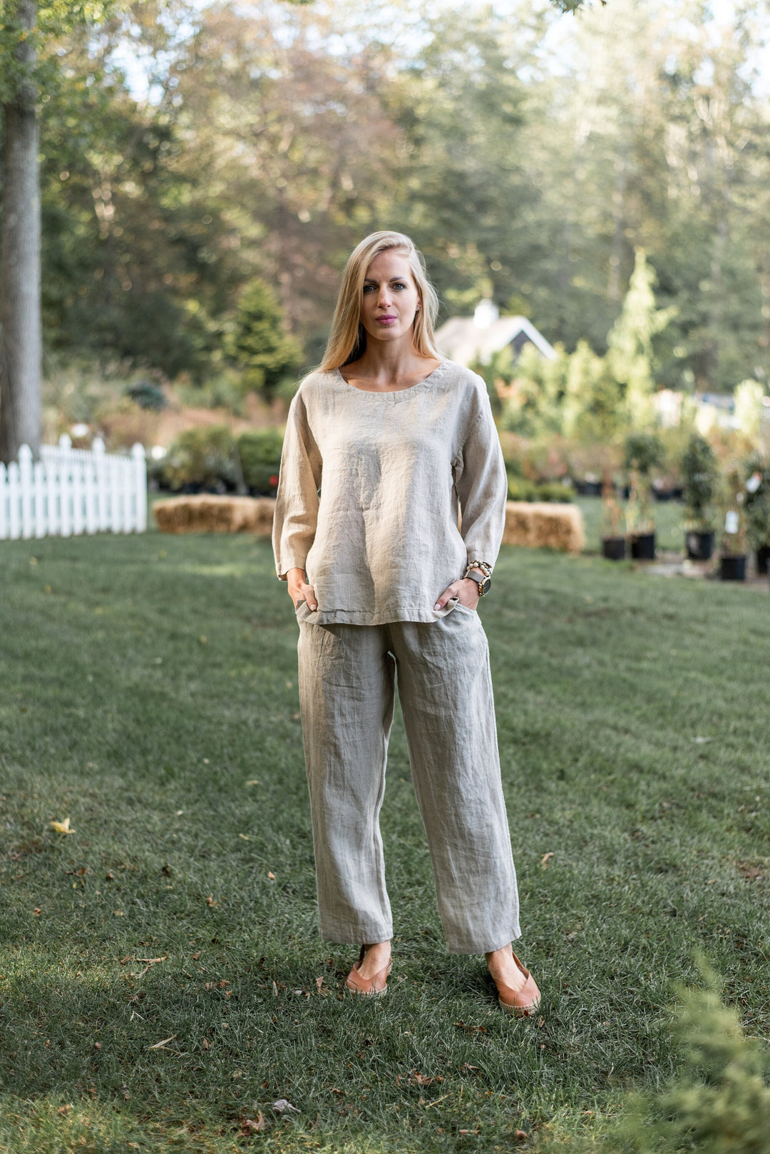 Full-length image of a woman in European flax trousers, front perspective