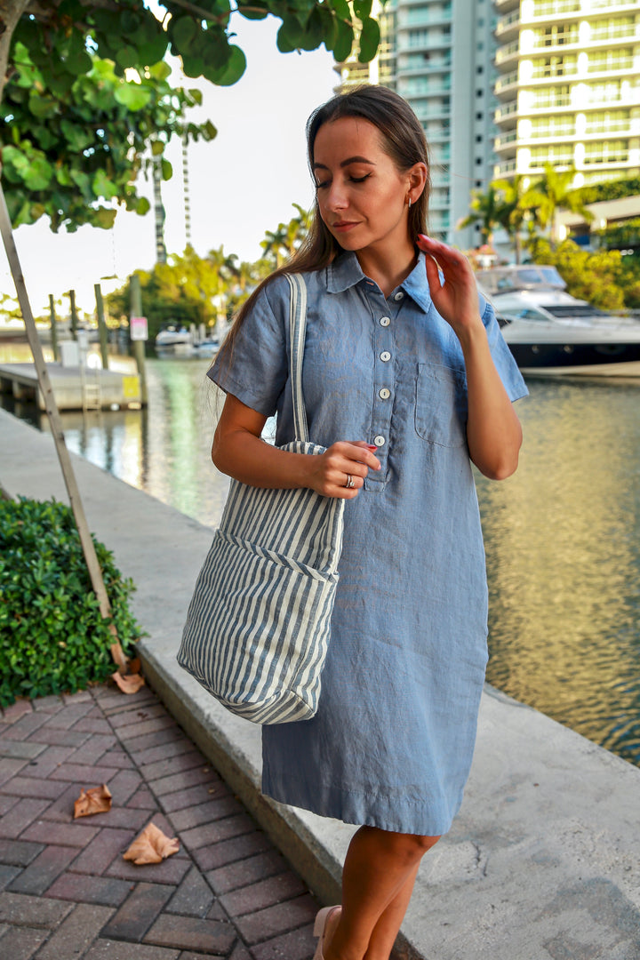 Detailing of the inseam pockets and straight fit of the Vika Linen Dress.