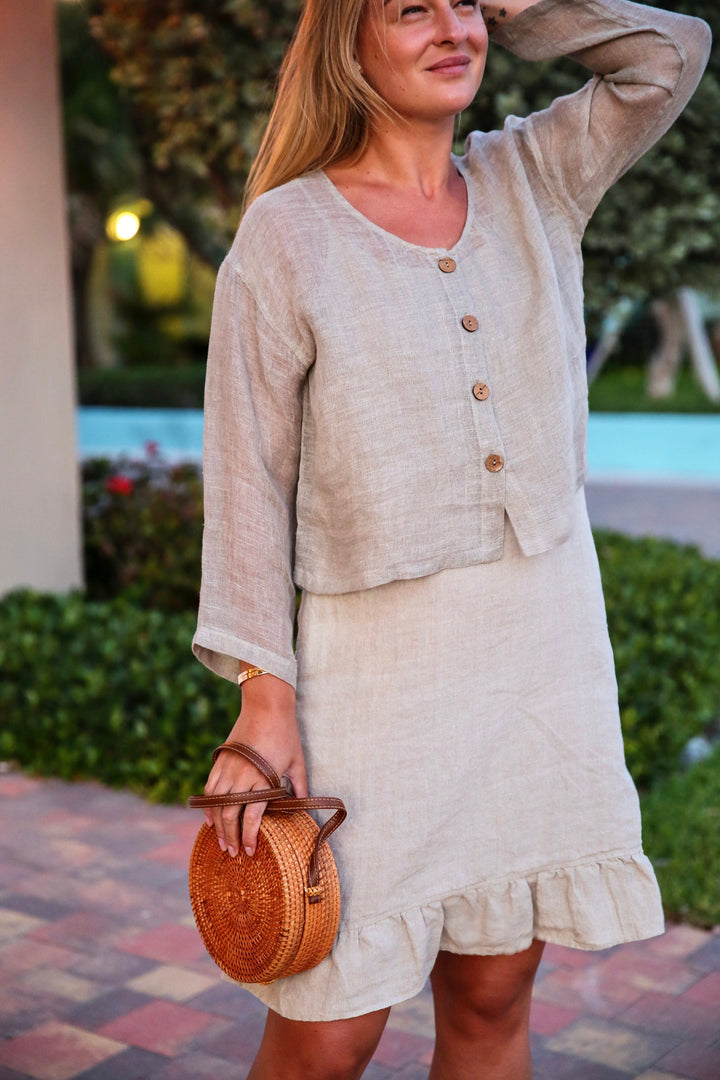 Young woman is wearing a Beige  Elegant Linen Sheer Jacket