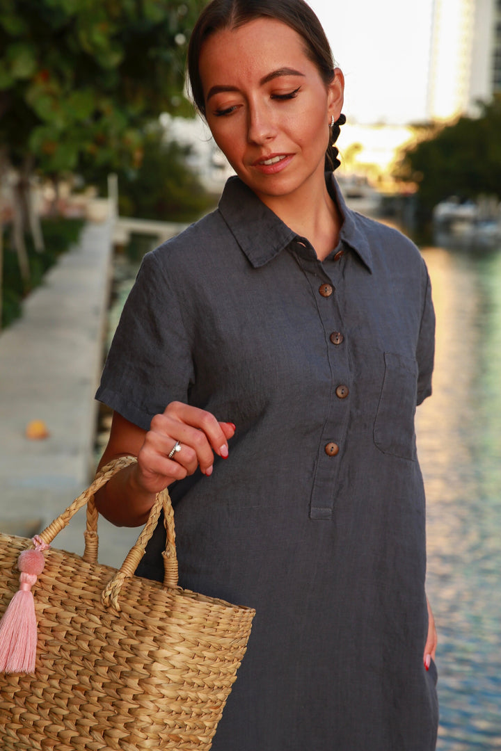 Timeless charm: Woman enjoying summer in a breathable linen tunic dress.