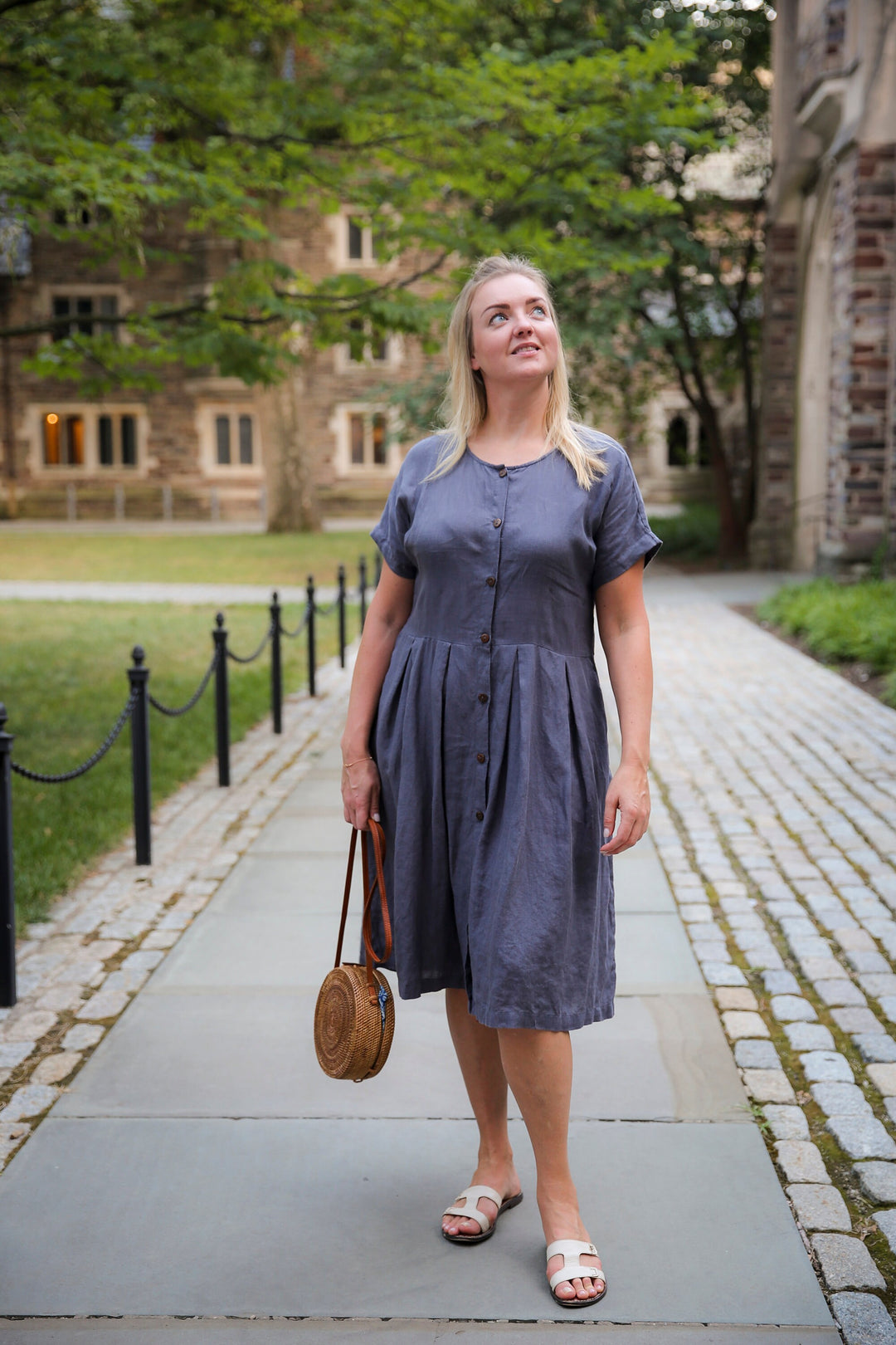 Model walking confidently, showcasing the lightweight nature of the Adri Dress.