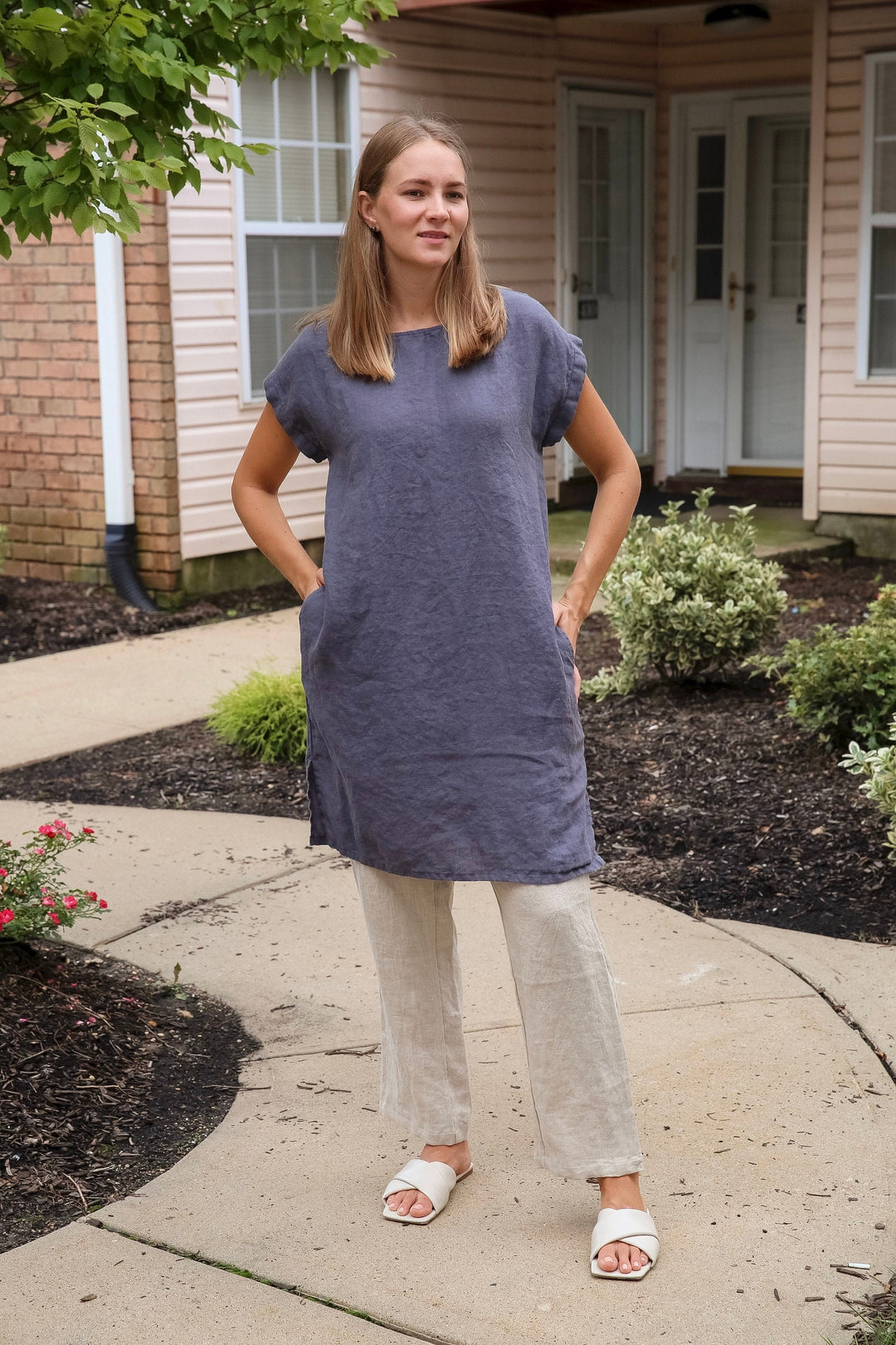 Elegant woman wearing a linen homecoming dress for summer.