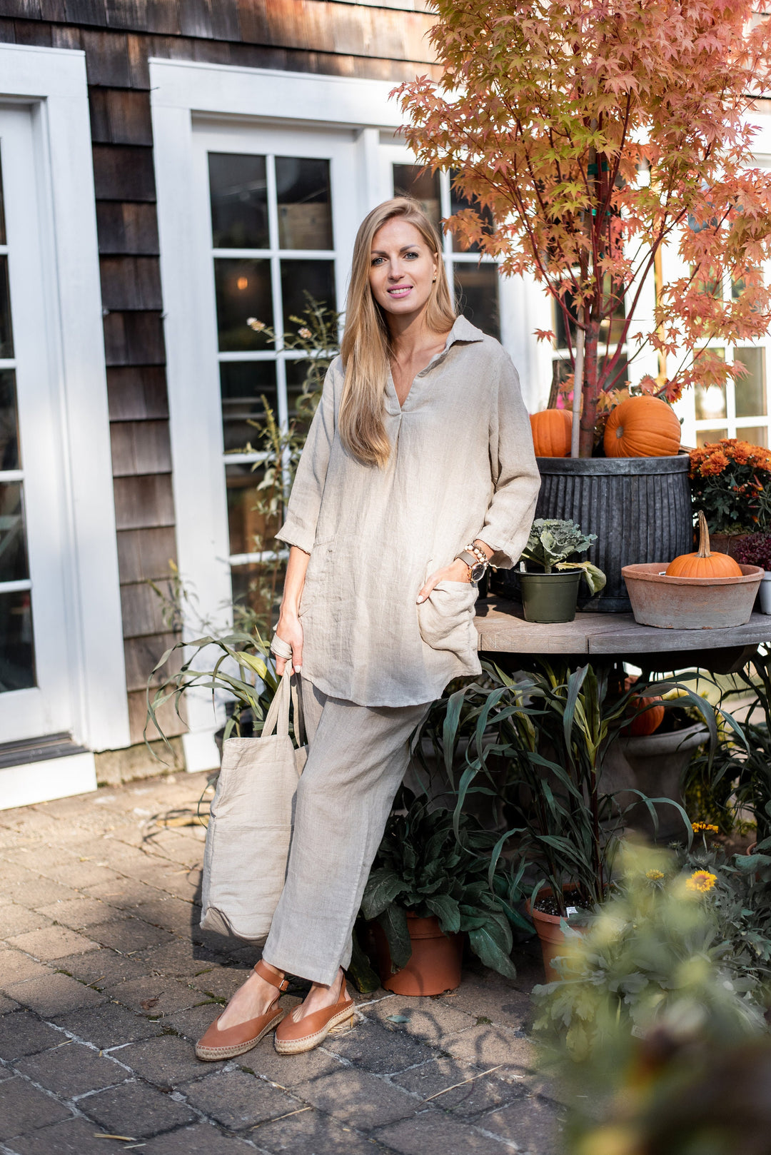 Linen October Tunic styled with autumn accessories on a model.