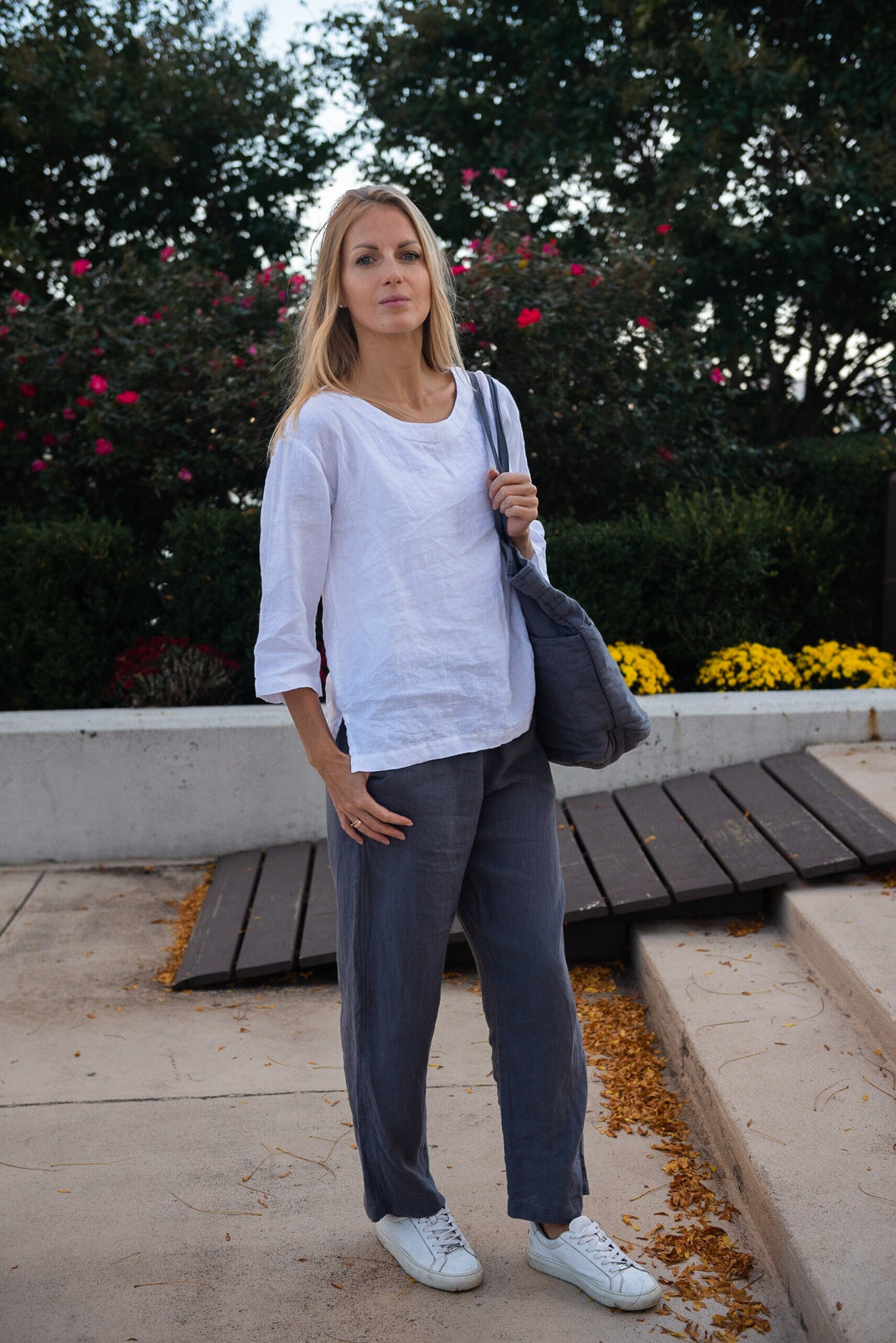 Woman wearing linen wide-leg pants, front view, showcasing relaxed fit