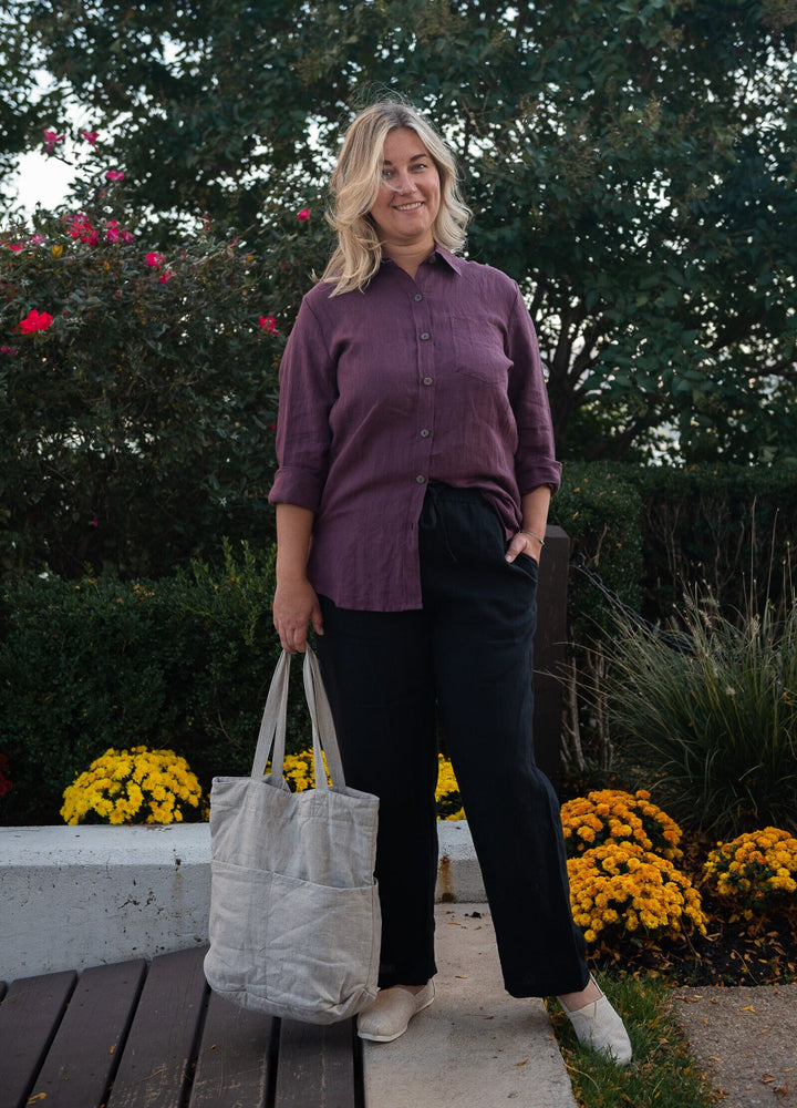 Full-length shot of a woman in soft European flax trousers, front angle.