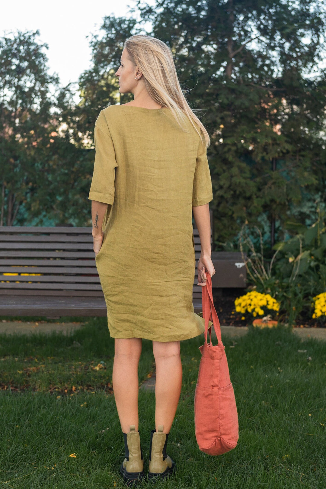 Close-up of the medium-weight fabric of a boho linen tunic dress with pockets.