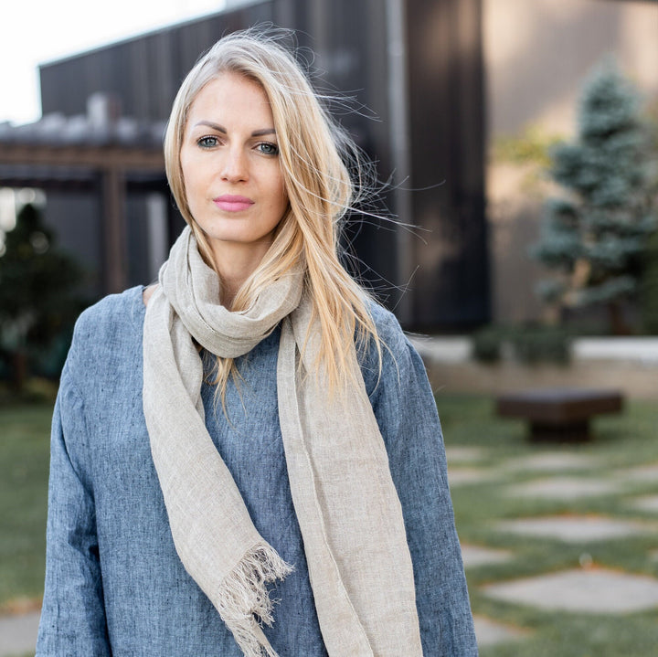 Linen scarf wrapped as a shawl, highlighting its width.