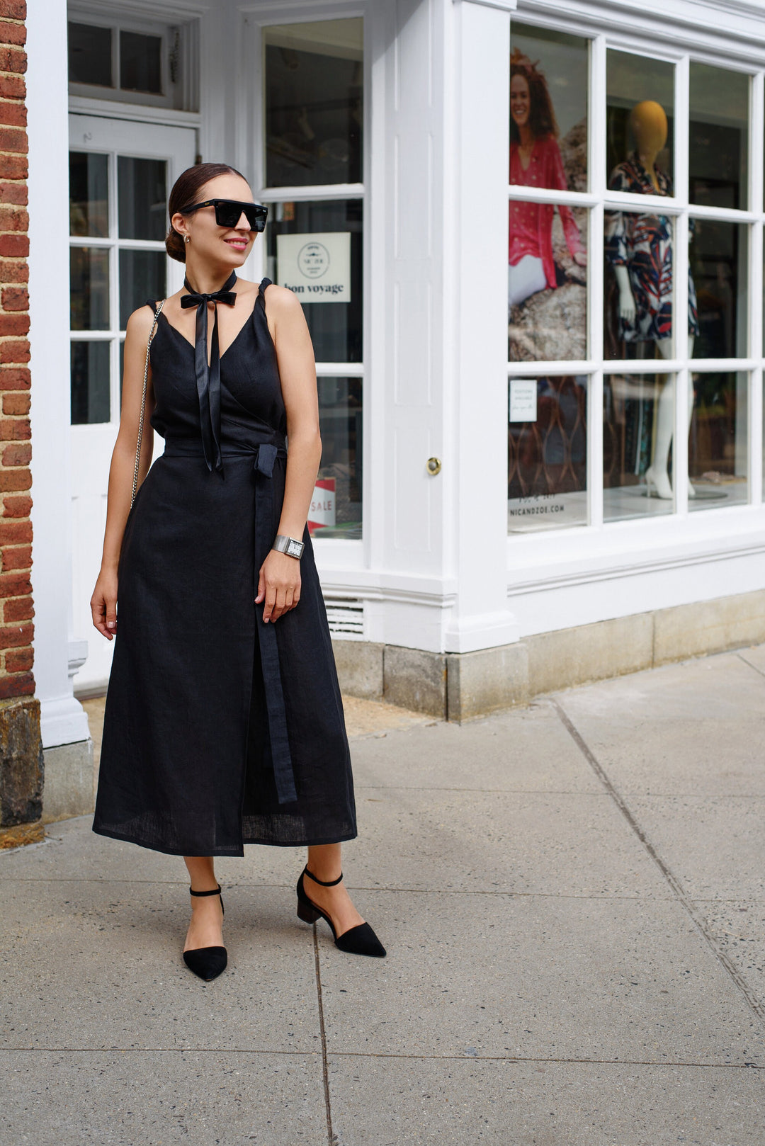 Effortlessly chic: Woman adorned in a linen wrap dress with a relaxed wrinkle look.