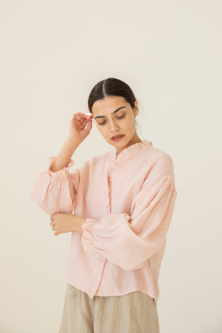 Feminine Linen Blouse with ruffle cuffs and lightweight design.