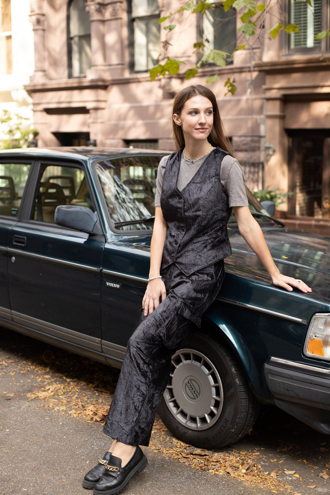 Stylish woman wearing the Velvet Vest, showcasing luxurious elegance and timeless fashion.