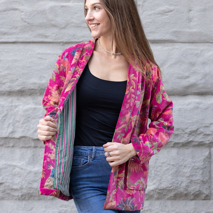 Model showcasing colorful striped lining inside Japanese Velvet Kimono Cardigan with Pink Bird Print Jacket open.